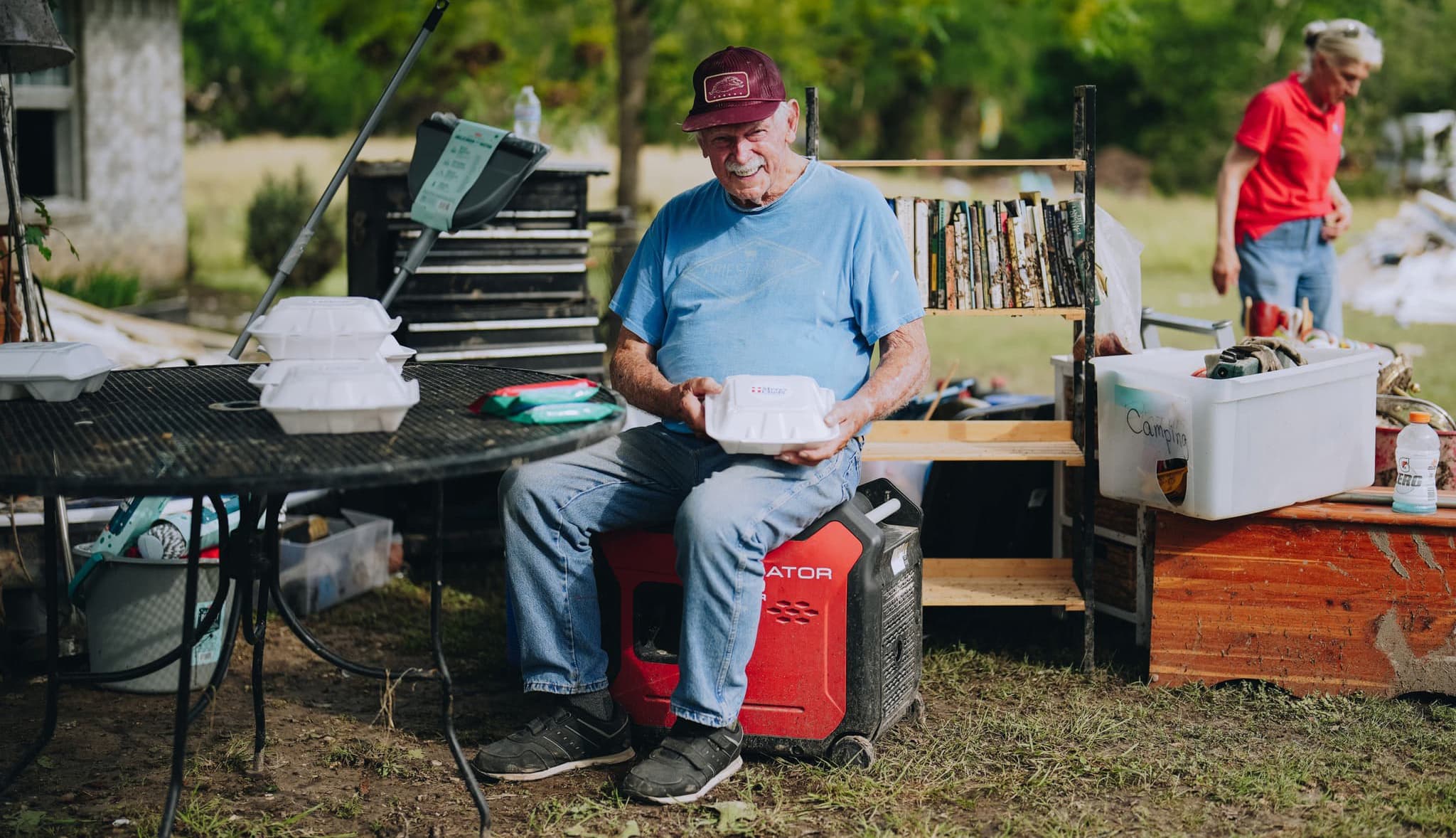 Smiling man opening meal package